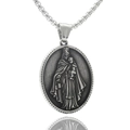Macro detail of silver oval pendant with religious figure relief and metal chain - Virgin Mary and Child