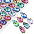 Macro detail of faceted teardrop crystal beads in vibrant gradient colors with pre-drilled holes - Mesh Teardrop / 13x22mm / Rainbow AB