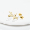 Exquisite gold hollow bird stud earrings shown on white ceramic plate background - Gold