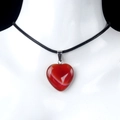 Red agate heart pendant necklace with black cord cord on a professional jewelry mannequin - Red Agate