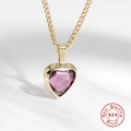 Macro detail of a heart-cut purple gemstone pendant on a gold S925 silver chain - Gold-Medium Purple Zirconia / 925 Silver