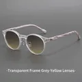 Retro round sunglasses with transparent frame and marble pattern arms in 45-degree view - Matte White Frame Grey Yellow Lens