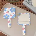Handheld floral makeup mirror with square glass surface and white handle with flowers - 15 Overjoyed