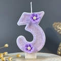 Number 3 birthday candle in light purple with glitter and decorative small flowers - Number 3