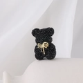 Sparkling black rhinestone bear charm with golden bow detail on white ceramic base - Gold Bow Black