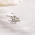 Macro view of a silver hollow star pendant with sparkling pavé cubic zirconia details - Silver (19x12mm Zircon Style)