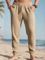 Textura de gofre de los pantalones jogging beige para hombre con cordón en la playa - S / Caqui