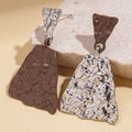 Macro detail of asymmetric geometric earrings featuring silver and chocolate enamel finish - Silver Earring Post - Coffee
