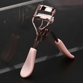 Rose gold eyelash curler with pink handle and built-in comb for natural lash lifting - Electrophoresis Pink Curler with Comb Pink Duckbill Handle Matching Rubber Pad