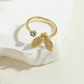 Macro shot of gold evil eye flower ring with sparkling crystals on white stone surface - Rabbit Ear Butterfly Style (JZ0409)