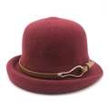 Detail of burgundy knit cloche hat with textured weave and brown leather buckle strap - M (56-58cm) / Burgundy