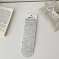 Classic ribbed grey cotton mid-calf socks with card packaging in a cozy lifestyle setting - One Size / Grey-Beige