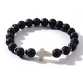 Detailed close-up of a black lava rock bead bracelet with a white cross and silver spacers - Black (Lava Rock)