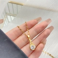 Élégant collier tour Eiffel en or 18 carats avec zircon étincelant et chaîne torsadée fine - Tour Eiffel