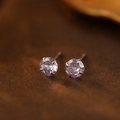 S999 silver stud earrings with light purple round cubic zirconia in four-claw setting - June Moonstone