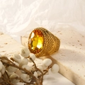 Macro shot of an oval yellow gemstone on a gold-plated stainless steel ring with textures - US 6 / Gold Yellow Zirconia