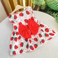 Detail of white pet dress with red strawberry print and a large decorative red bow - Red Strawberry
