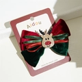 Detail of velvet Christmas bow hair clip with reindeer charm on display card - Elk Christmas Bow