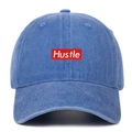 Detail of red rectangle HUSTLE embroidery on blue washed denim baseball cap - One Size / Light Blue