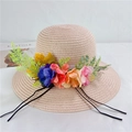 Straw sun hat with colorful floral accents and black ribbons on a flat background - M (56-58cm) With Wind Rope / Light Pink