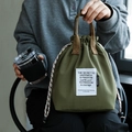 Army green insulated bucket lunch bag with drawstring closure and sturdy woven handles - Pine Green