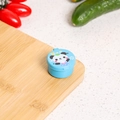 Blue mini sauce container with cartoon panda lid on a wooden cutting board - Panda / Blue