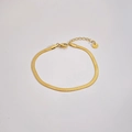 Macro detail of gold stainless steel flat snake chain bracelet with lobster clasp and tag - Flat Snake Chain