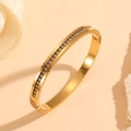 18k gold plated stainless steel geometric bangle with diamonds in a 45-degree view - Gold Wave Edge Zircon Style (H420)