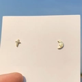 Golden moon and star stud earrings with tiny crystals held against a clear blue sky - 925 Silver Needle / Gold Cross & Moon