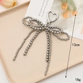 Silver heart bow keychain accessory with metallic beads and clasp in a minimalist style - Double Bow Silver UV Beaded