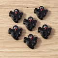 Detail of six glossy black resin ghosts for Halloween DIY phone case decorations - 10 Pieces Pack / Ghost Face