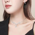 Elegant silver-tone teardrop rhinestone necklace and earring jewelry set on a model - Tassel Style Rhinestone Jewelry Set (DTN10026300S)