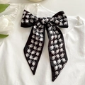 Classic black and white houndstooth bow headband with satin finish on white shirt - Black Houndstooth