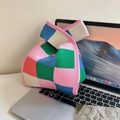 Knitted tote bag with colorful checkered pattern beside a laptop on a desk - Colorful Plaid Pink