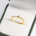 Close-up of 18k gold plated letter K ring with diamonds in a green velvet jewelry box - K Gold