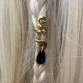 Detail of golden snake hair jewelry with black teardrop pendant on braided blonde hair - Black Pendant
