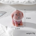 Detailed view of flocked resin dog charm with size 3.5cm x 2.2cm and 10g weight display - Golden Dog in Red Clothes