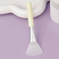 Silicone face mask brush with white fan-shaped head and light yellow handle on lavender background - Slanted Tail Style B / Yellow