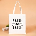 White canvas Team Bride tote bag with Bride Tribe heart arrow print for wedding party - Black Heart Arrow Bride