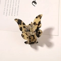 Macro shot of butterfly hair claw with cream and black tortoiseshell texture and gold spring - Light Coffee Butterfly Claw