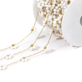 Gold-plated stainless steel chain with white daisy beads and gold beads on white spool - 0.8mm Gold Chain/9mm White Flower