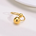 Macro detail of adjustable gold titanium steel ring featuring dual polished beads design - F10075 Double Ball Gold