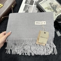 Solid grey cashmere feel scarf with tassel detail and minimalist brand label on a flat lay - 200x68cm / Medium Grey