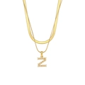 Detail of gold double-layer chain necklace featuring letter Z pendant and white pearls - Letter Z