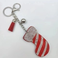 Detailed view of a red rhinestone Christmas stocking keychain with silver bell and tassel - Christmas Sock Style 2