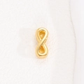 Detailed close-up of a polished gold infinity symbol charm for DIY mesh bracelets - Infinity Charm