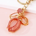 Pink tulip flower keychain with rose rhinestones and cat-eye stone in gold finish - Three Pink Tulips