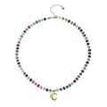 Close-up of bohemian colorful gemstone beaded necklace with golden bubble letter C pendant - Letter C