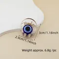 Close-up of blue Evil Eye hair claw clip with size measurements 3cm by 2.9cm - 3cm Round Eye Claw Clip