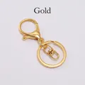 Detailed view of the gold-plated lobster clasp with swivel joint and keyring kit - Gold